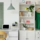 closet plus office set up with clothes hanging and desk with laptop